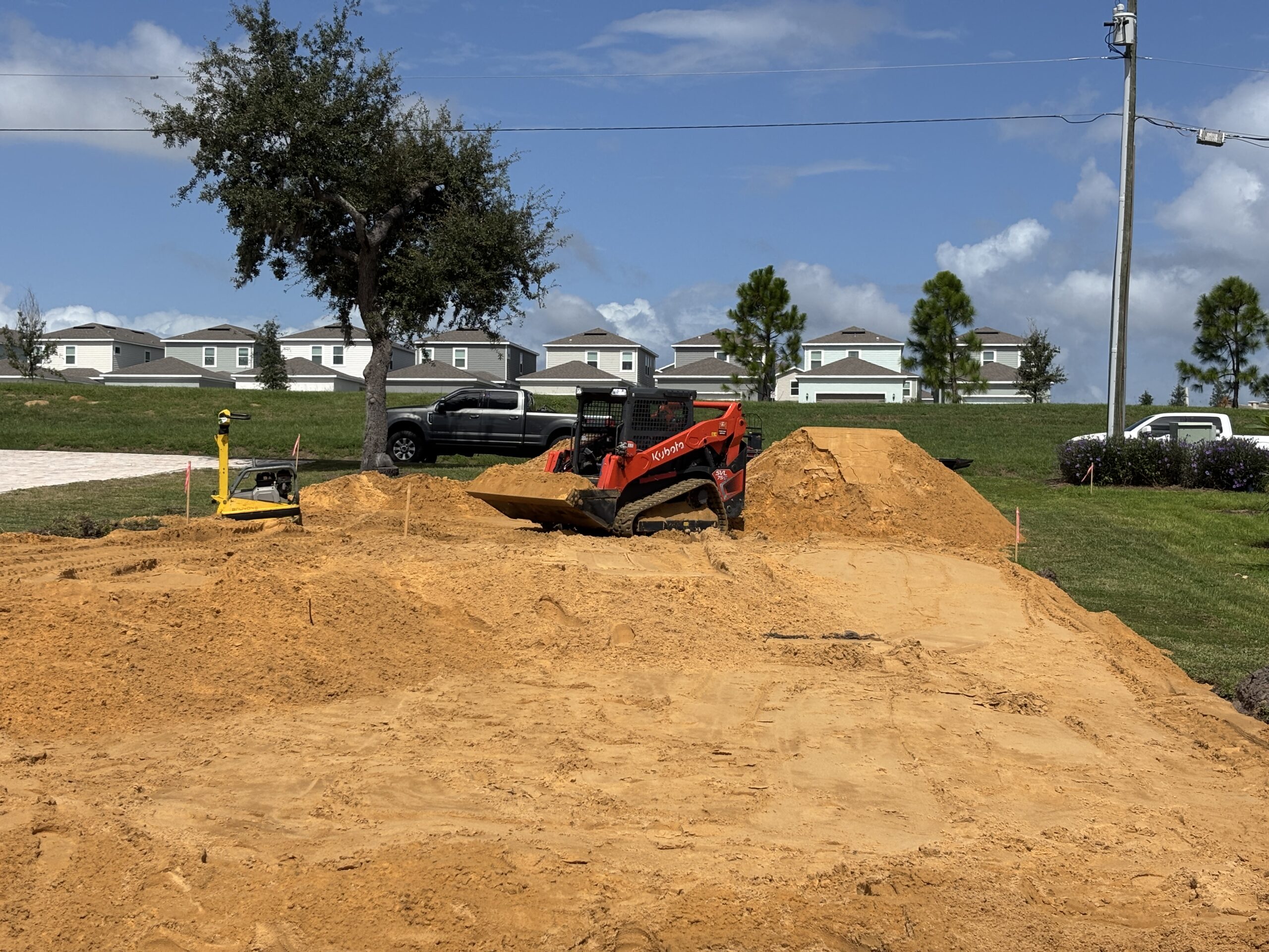Retention pond repair and grading project in Lakeland, Florida restoring proper drainage and reshaping pond slopes. Brannigan Land Services specializes in pond restoration, excavation, and erosion control across Polk County and Central Florida.